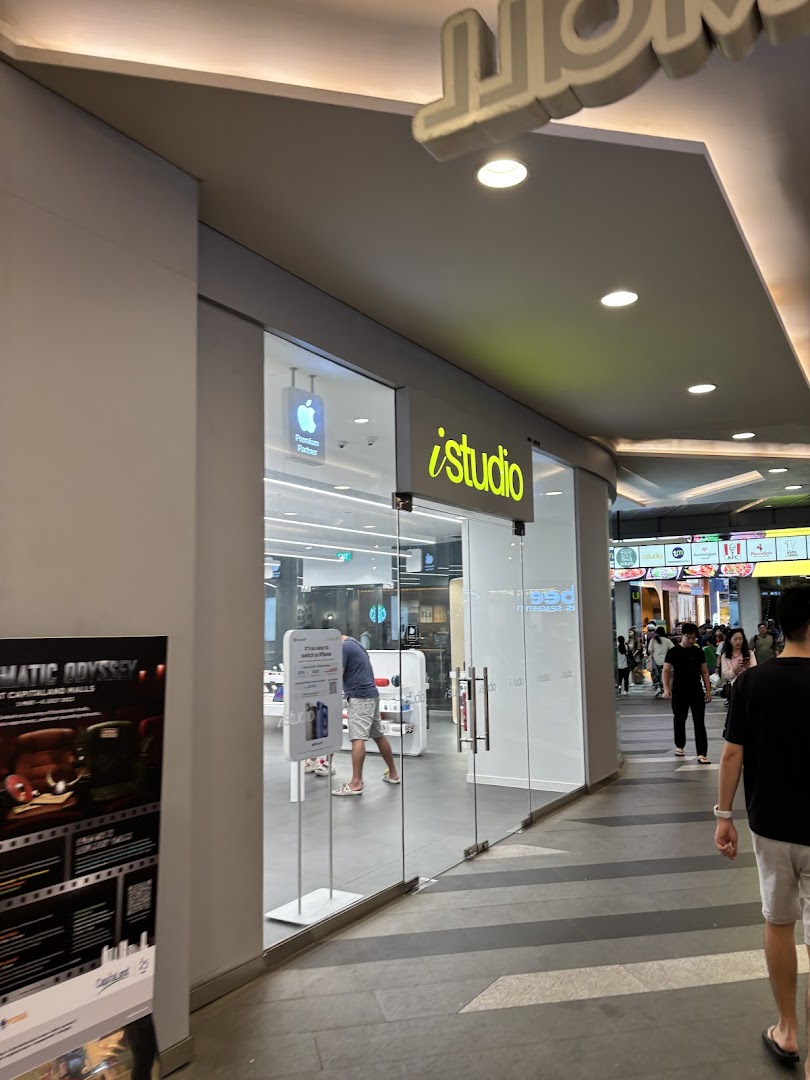 The bright, modern storefront of iStudio, an Apple Premium Reseller, at Tampines Mall.