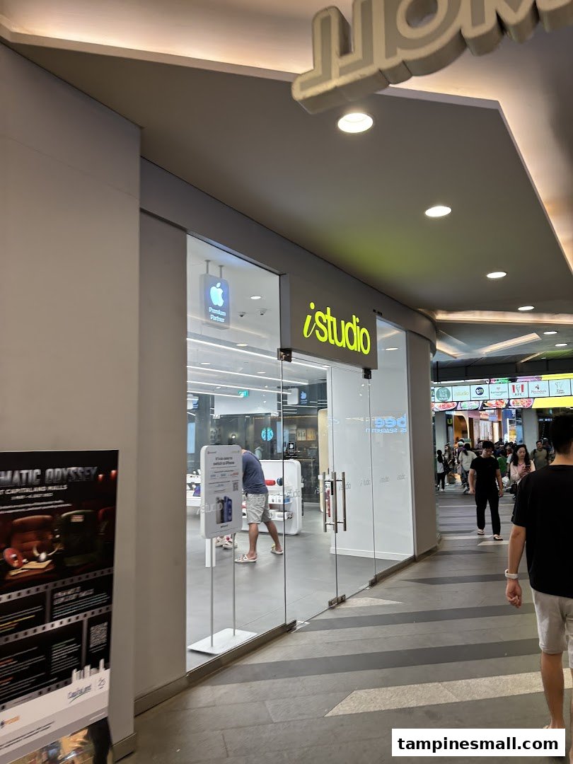 The bright, modern storefront of iStudio, an Apple Premium Reseller, at Tampines Mall.
