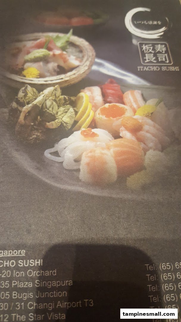 A menu page displaying vibrant sushi and sashimi platters alongside Itacho Sushi's Singapore location details.