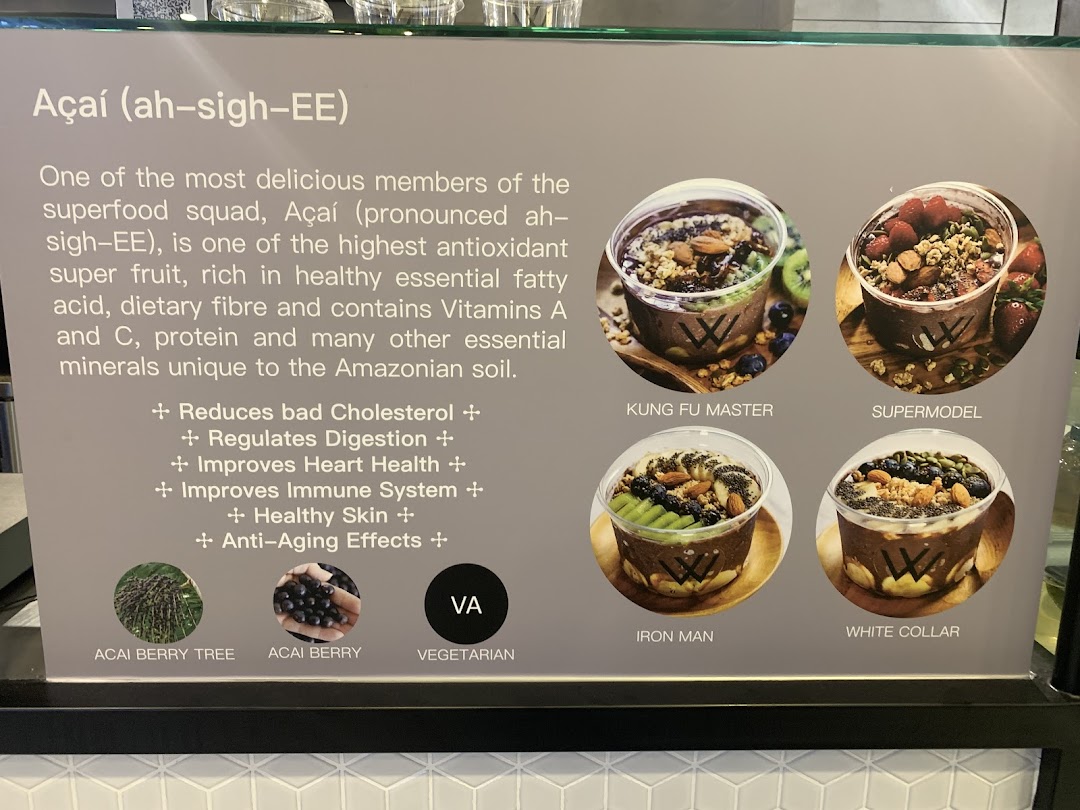 A display board showcasing various Açaí bowls with their health benefits and names.