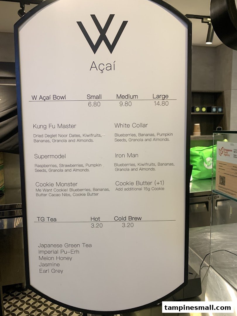 A detailed menu board for W Açaí, showcasing various açaí bowls, their ingredients, sizes, prices, and tea options.