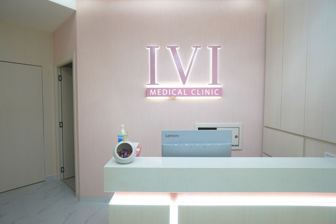 Interior view of IVI Medical Clinic's reception desk with illuminated logo.