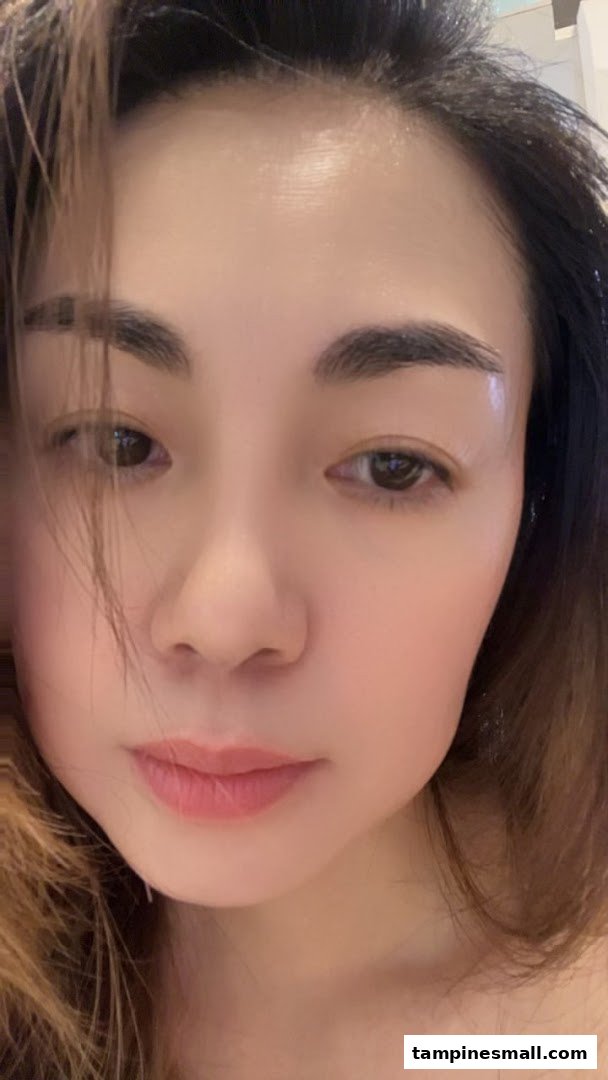 A close-up portrait of a person's face, highlighting clear skin and natural features.