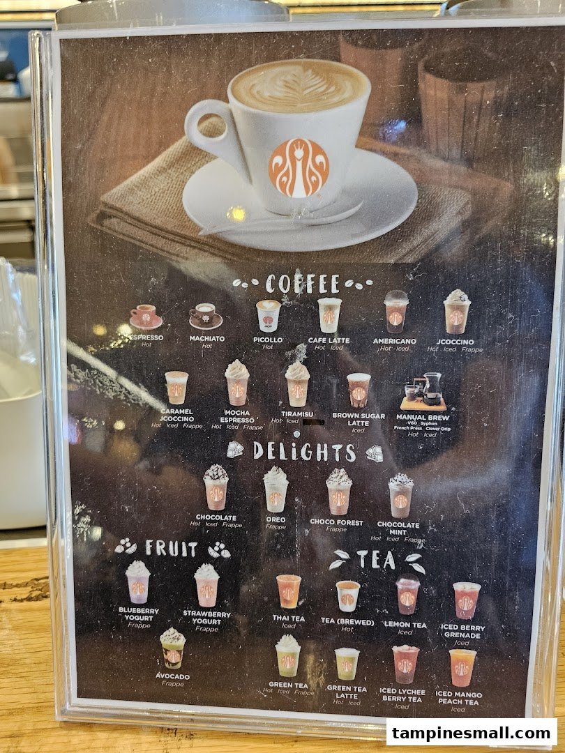 A detailed menu board displaying various coffee, delight, fruit, and tea beverages from J.Co Donuts & Coffee.