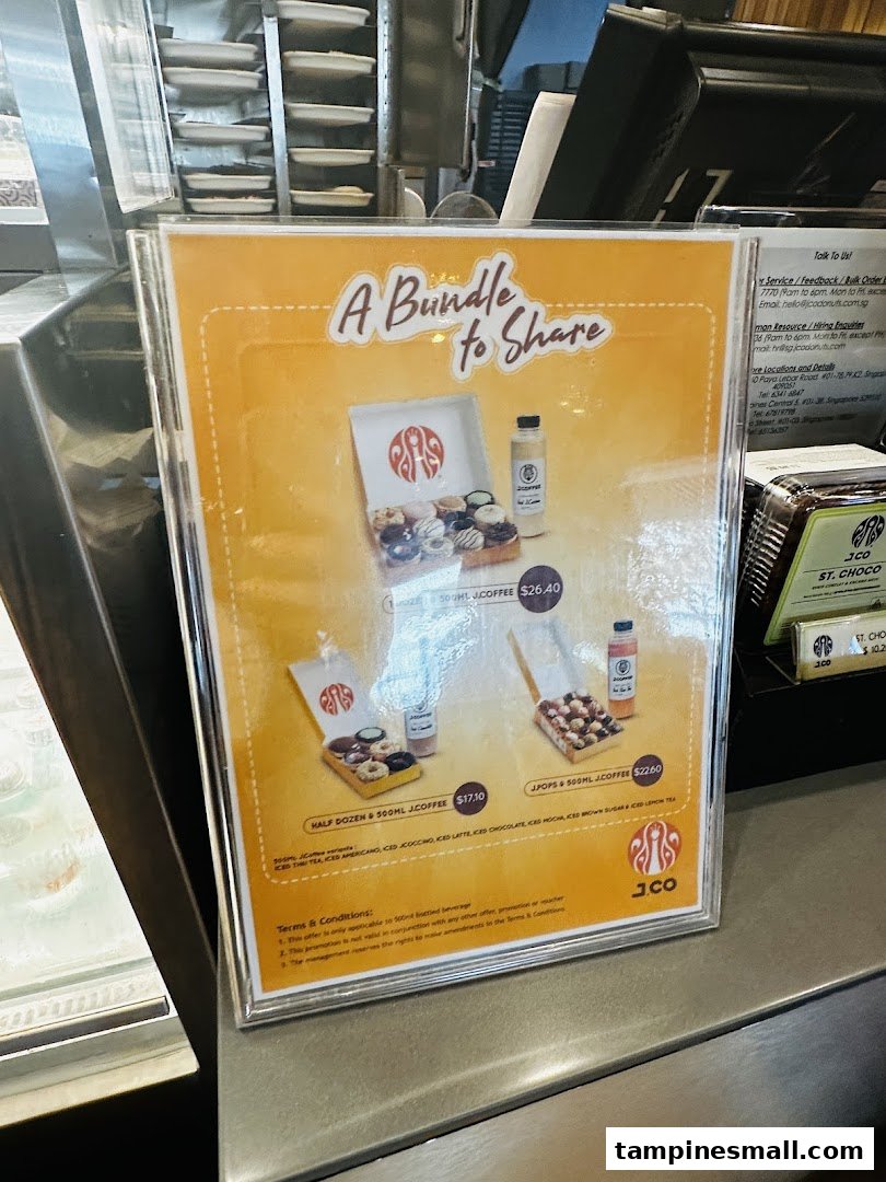 A promotional poster displaying J.Co Donuts & Coffee bundle deals with various donut and coffee combinations.