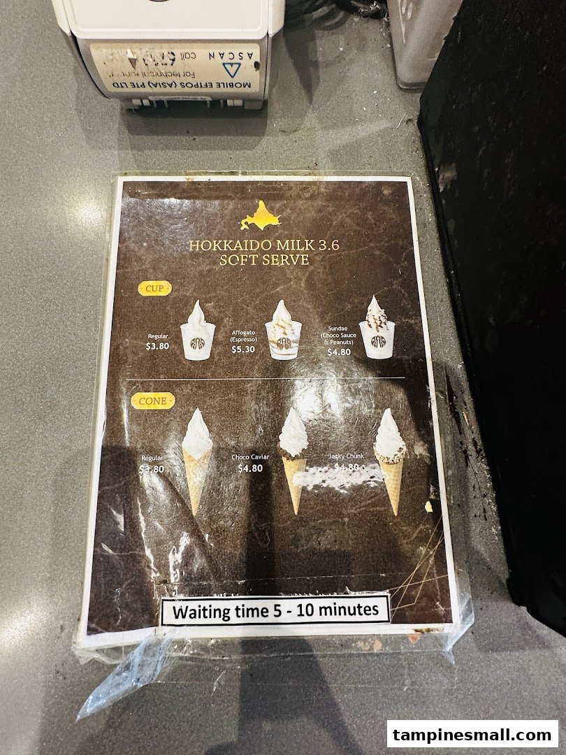 A menu displaying Hokkaido Milk 3.6 soft serve options in cups and cones with prices.