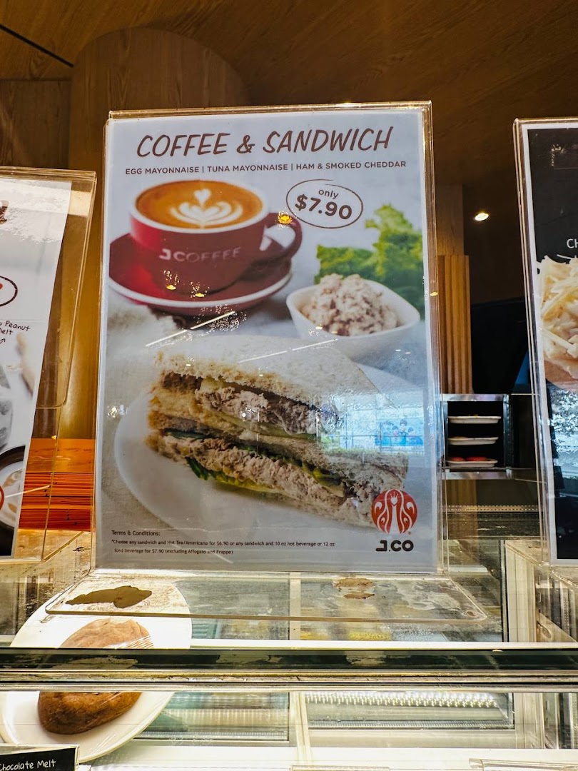 A promotional display for J.Co's Coffee & Sandwich combo featuring various sandwich options for $7.90.