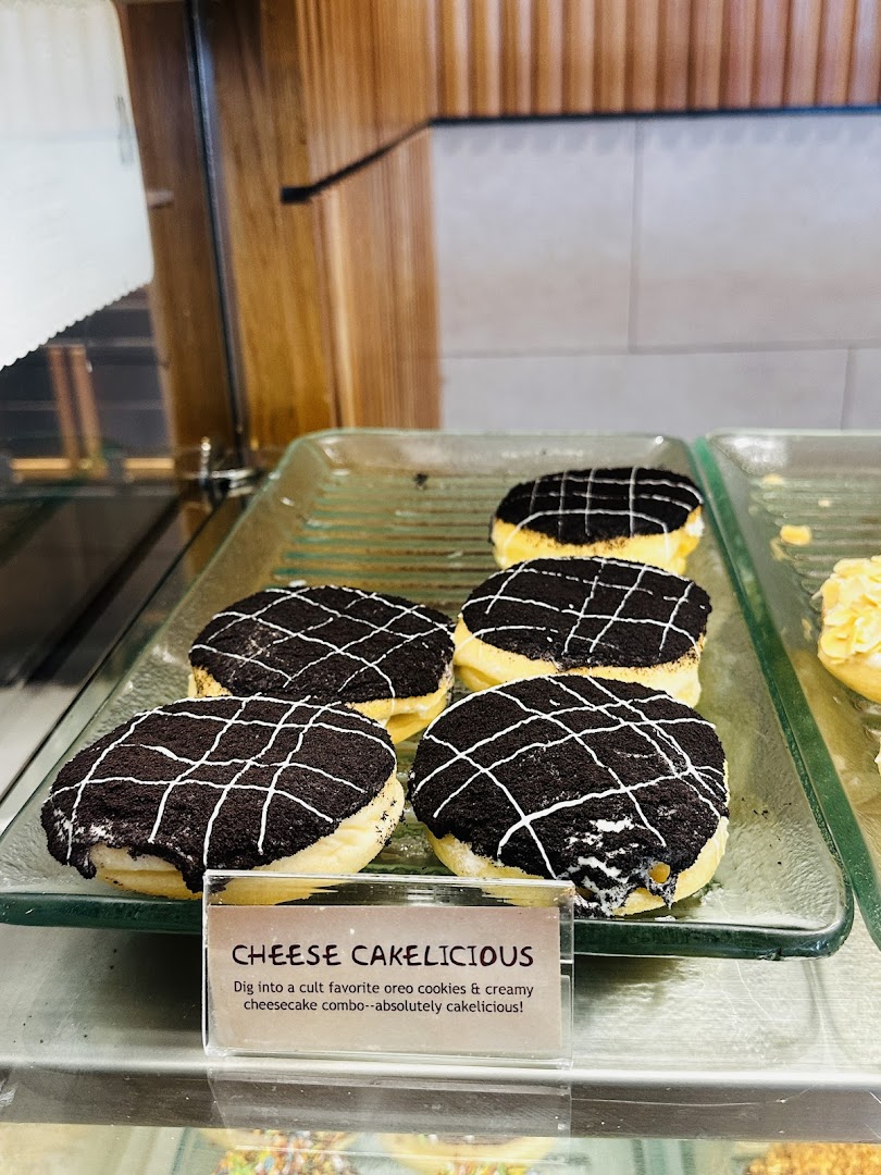 A display of J.Co's 'Cheese Cakelicious' donuts with Oreo cookies and cheesecake filling.