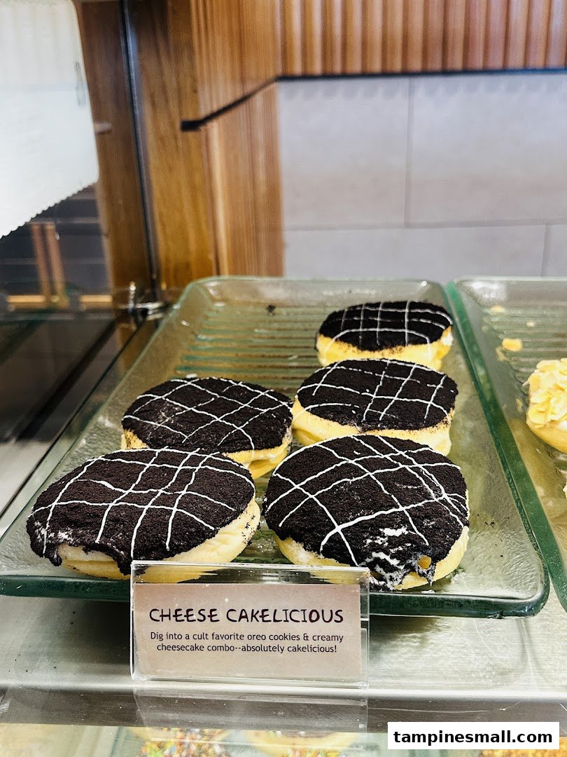A display of J.Co's 'Cheese Cakelicious' donuts with Oreo cookies and cheesecake filling.