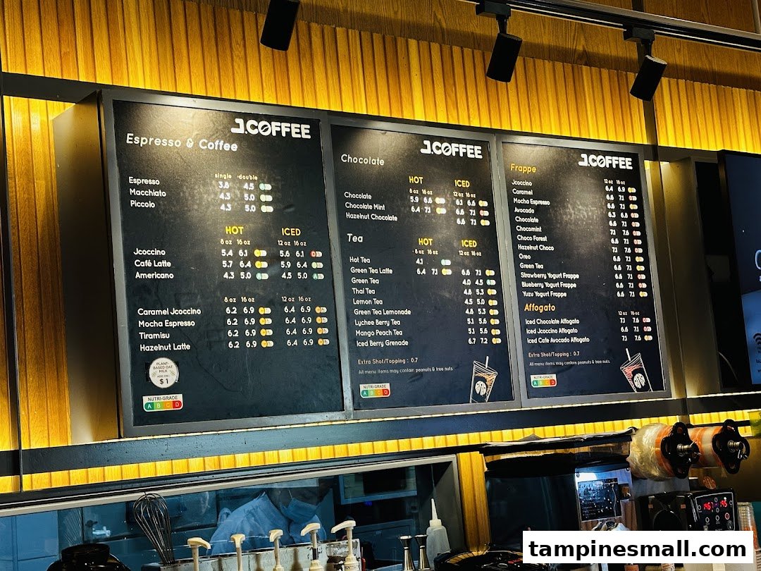 Multiple menu boards displaying coffee, chocolate, tea, and frappe options at J.Co Donuts & Coffee.
