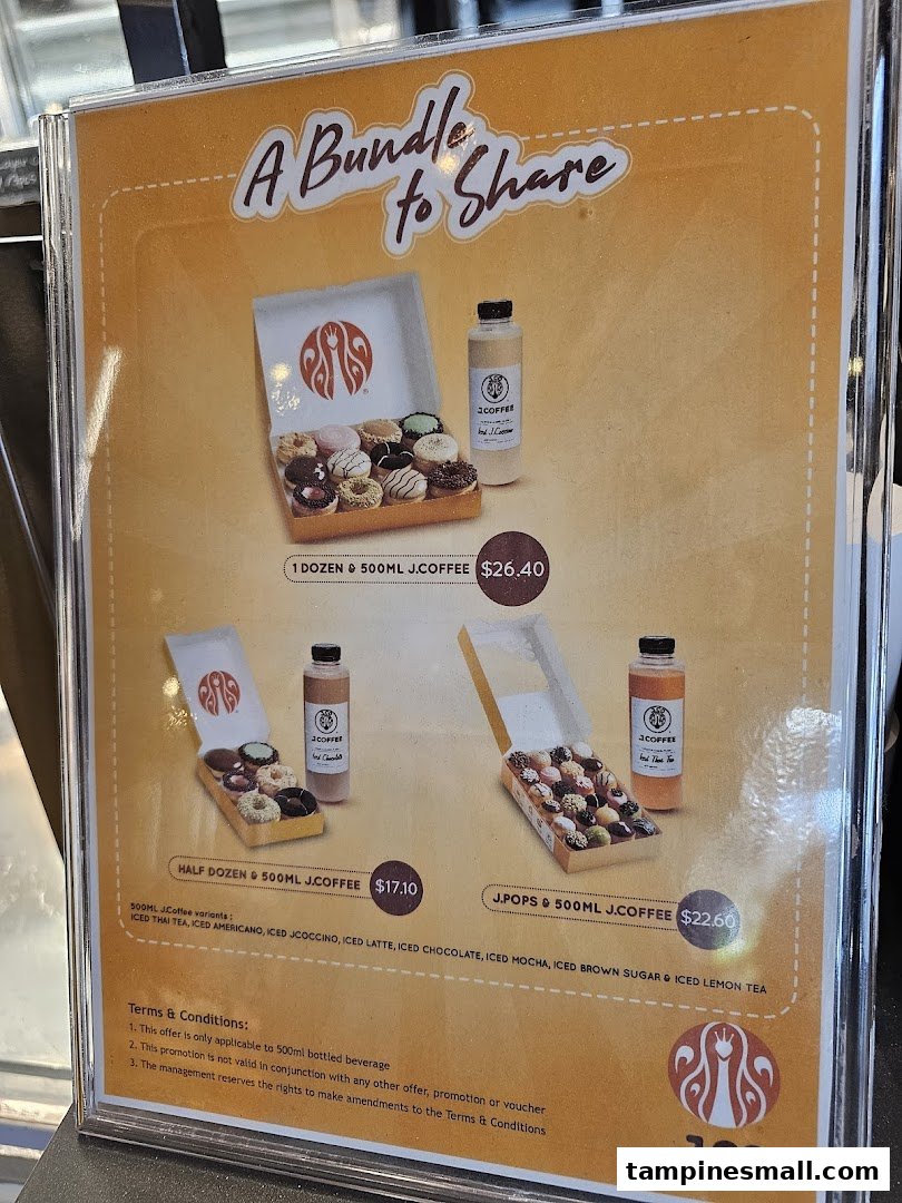 A promotional menu board displaying J.Co Donuts & Coffee bundle deals with donuts and bottled coffee.