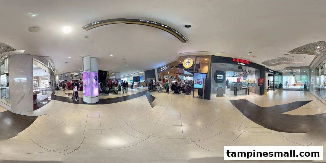 The bustling storefront of J.Co Donuts & Coffee, with customers queuing, located within Tampines Mall.