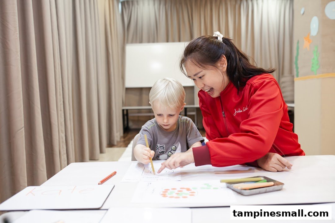 An instructor and a child engaged in a creative learning activity at Julia Gabriel Centre.