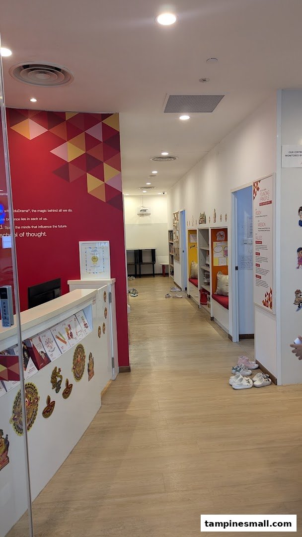 Interior view of Julia Gabriel Centre showing the reception desk, hallway, and learning spaces.