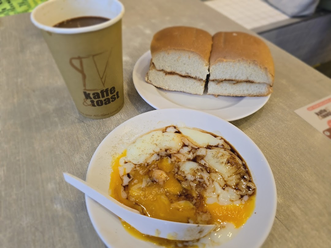 A classic Singaporean breakfast set with coffee, kaya toast, and soft-boiled eggs from Kaffe Toast.