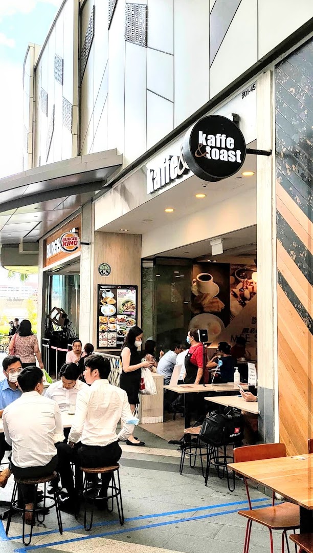 Kaffe & Toast shop front with outdoor seating and customers enjoying coffee and toast.
