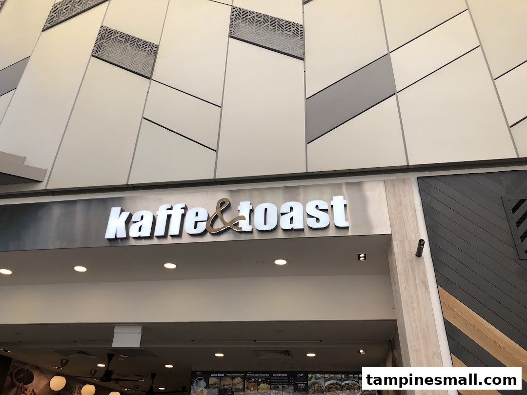 The shopfront of Kaffe & Toast, featuring its prominent logo and modern mall architecture.