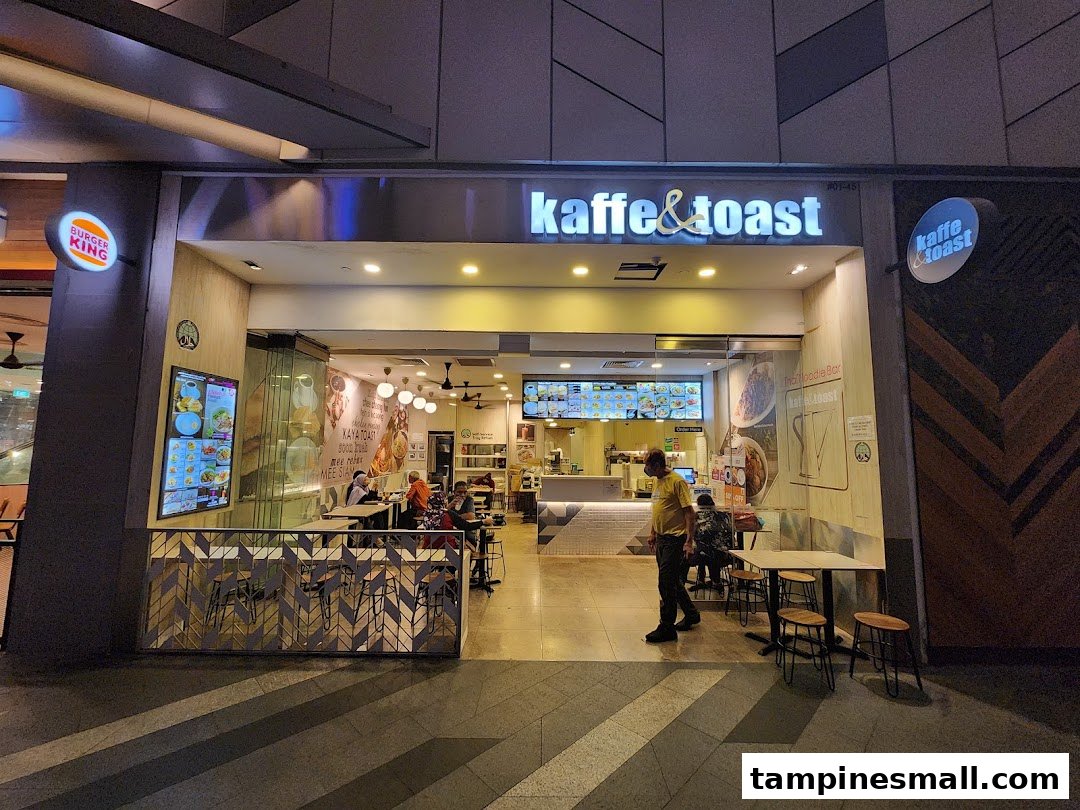 Exterior view of Kaffe & Toast, showcasing its entrance, interior, and outdoor seating area.