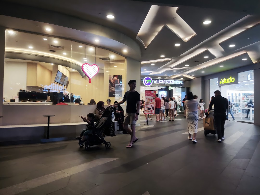 Exterior view of Kenangan Coffee at Tampines Mall, showing its entrance and a vibrant mall corridor.