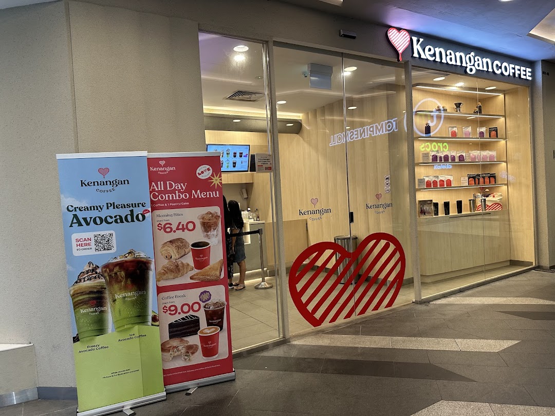 The inviting shopfront of Kenangan Coffee, featuring promotional banners for avocado drinks and combo menus.