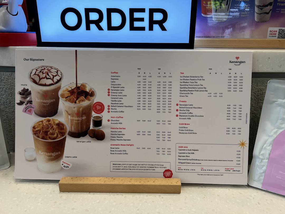 A comprehensive menu board for Kenangan Coffee, displaying various hot and iced beverages with their prices.