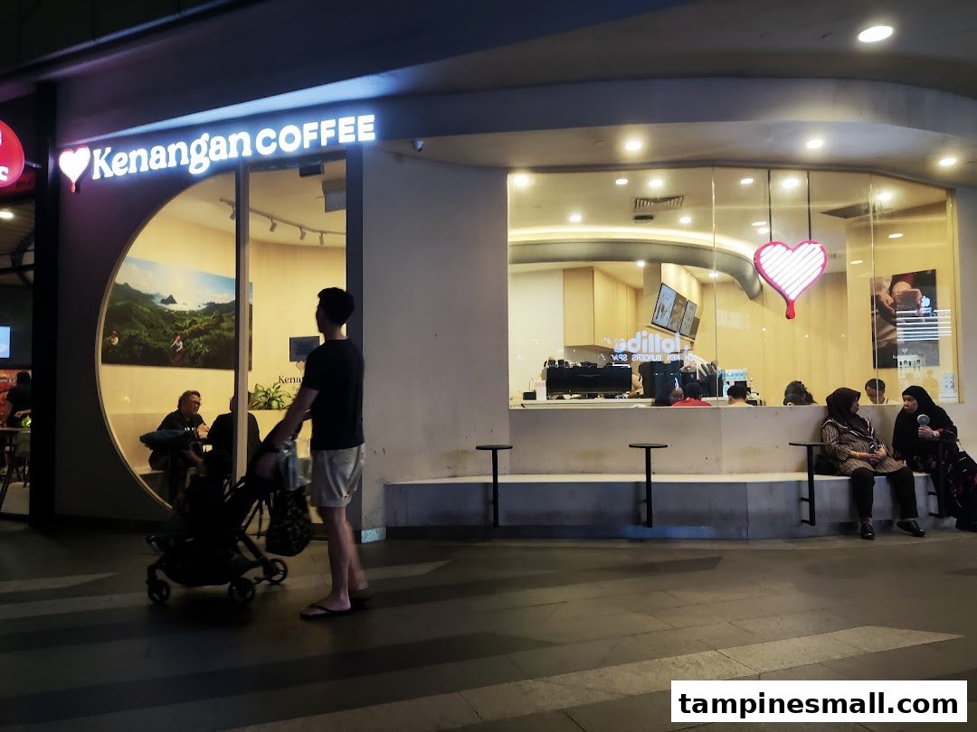 Exterior view of Kenangan Coffee at Tampines Mall, featuring its distinctive heart logo and inviting facade.