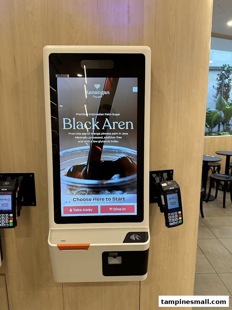 A self-service kiosk at Kenangan Coffee featuring their Black Aren palm sugar drink.
