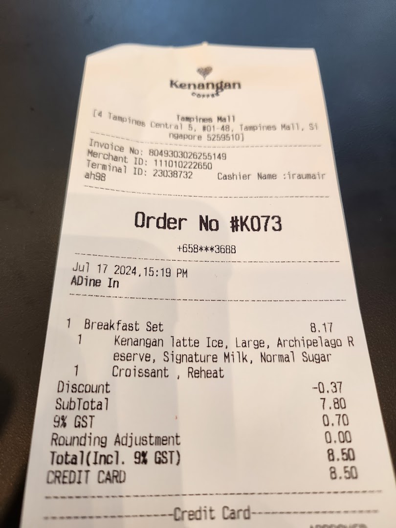 A receipt from Kenangan Coffee showing a breakfast set order with Kenangan Latte Ice and Croissant.
