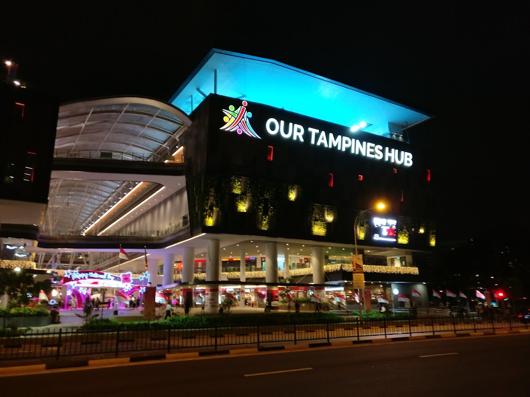 Our Tampines Hub illuminated at night, a vibrant community and lifestyle destination.
