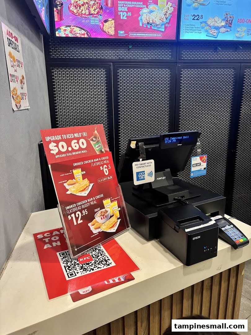 KFC ordering counter showcasing digital menu boards and promotional offers.