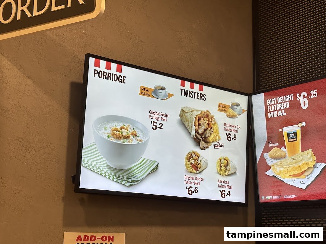 KFC menu board displaying breakfast items like porridge, twisters, and flatbread meals.