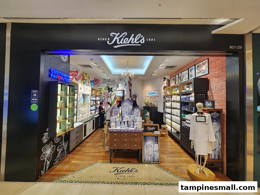 The inviting entrance of Kiehl's skincare store, showcasing its unique product displays and signature skeleton mascot.