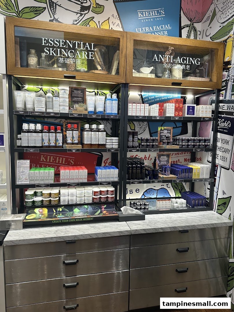 A well-lit display of Kiehl's skincare products, featuring essential and anti-aging ranges.
