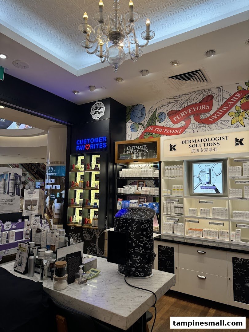 Interior view of Kiehl's store showcasing skincare products, display counters, and branding.