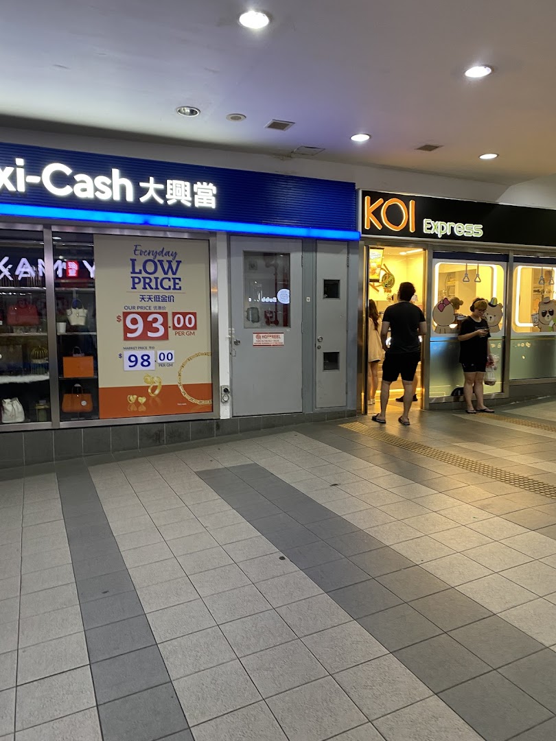 The storefronts of KOI Express and Maxi-Cash at Tampines Mall, with people entering KOI.