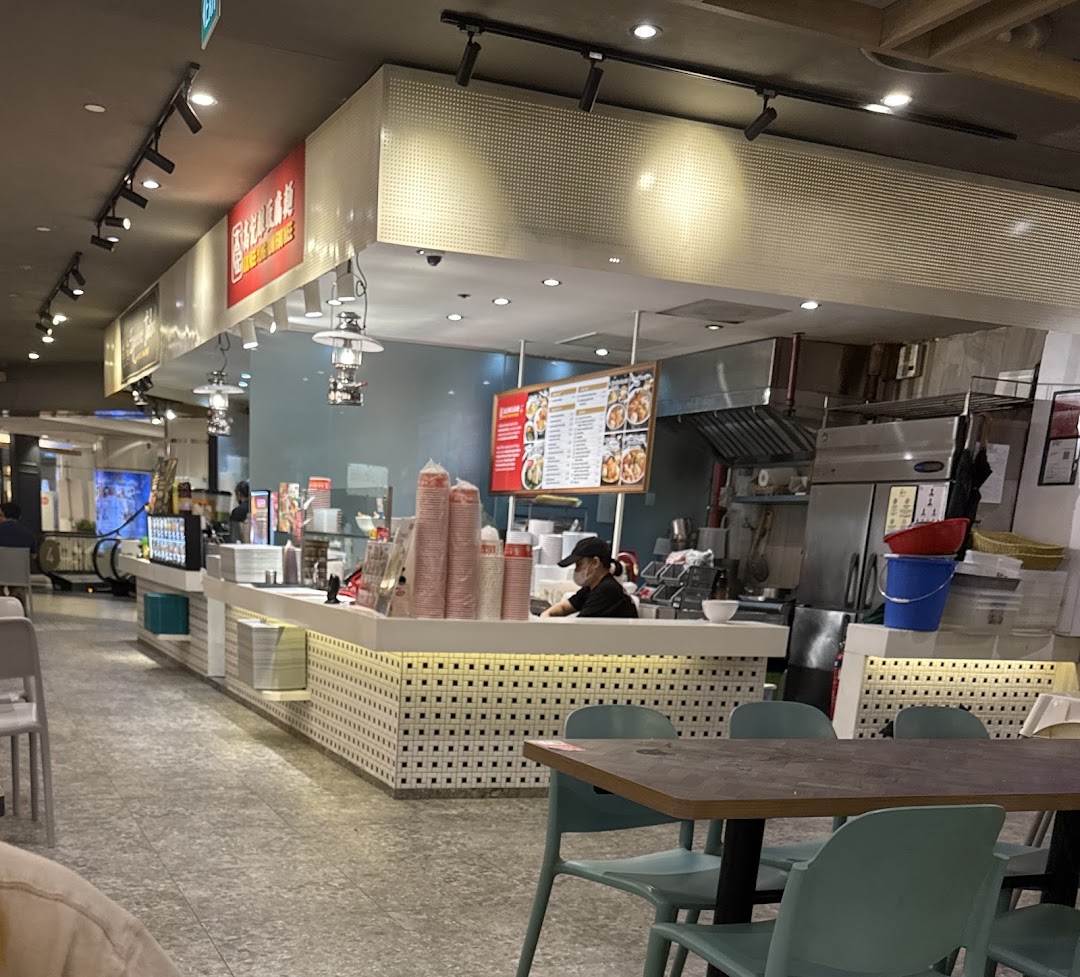 An interior view of Koo Kee Yong Tow Foo Mee, showing the counter, kitchen, and dining area.
