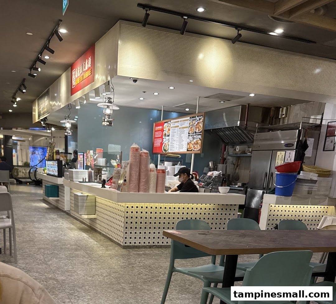 An interior view of Koo Kee Yong Tow Foo Mee, showing the counter, kitchen, and dining area.