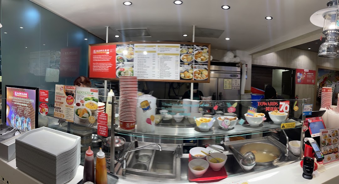 A comprehensive menu board displaying Yong Tow Foo Mee options, side dishes, and drinks at Koo Kee.