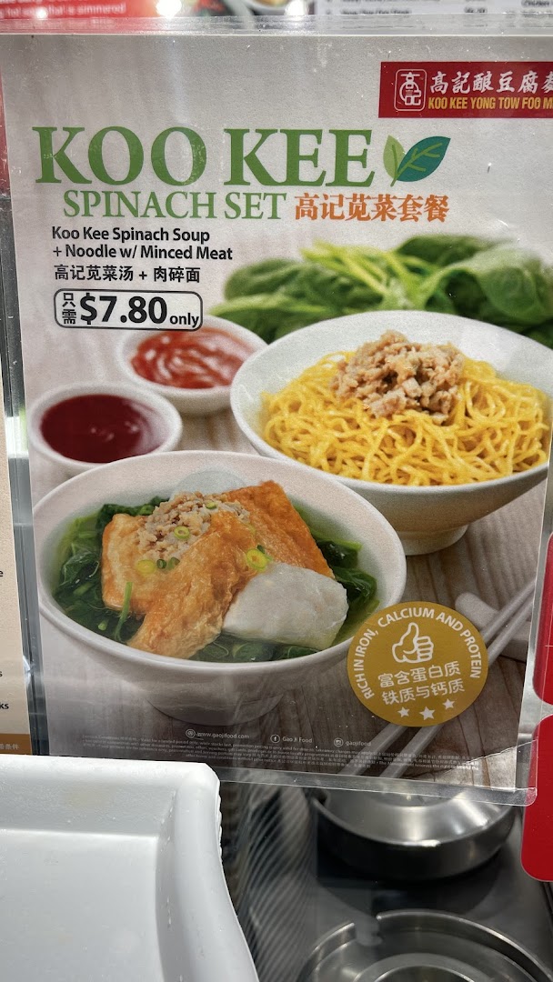 A menu board displaying the Koo Kee Spinach Set with soup, noodles, and Yong Tow Foo.