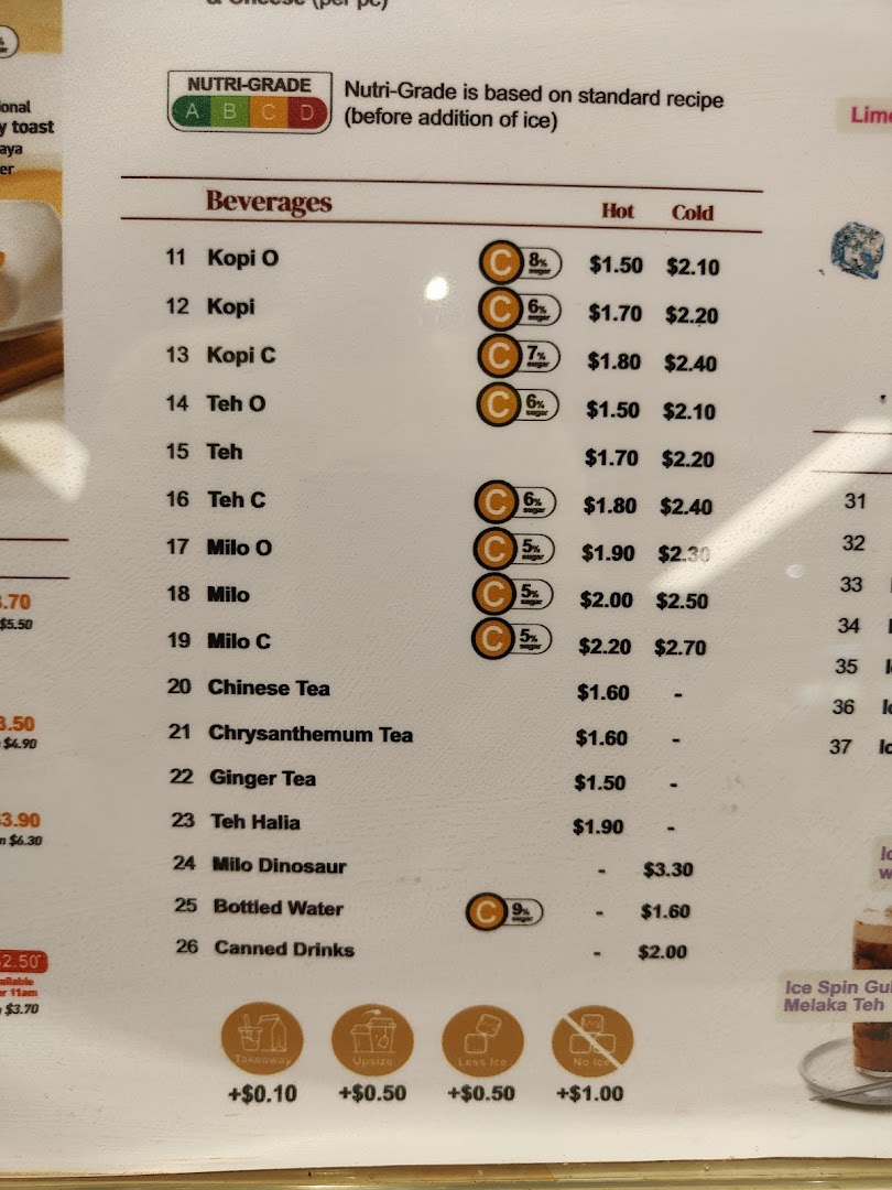 A detailed menu board displaying a variety of hot and cold beverages with prices and Nutri-Grade information.