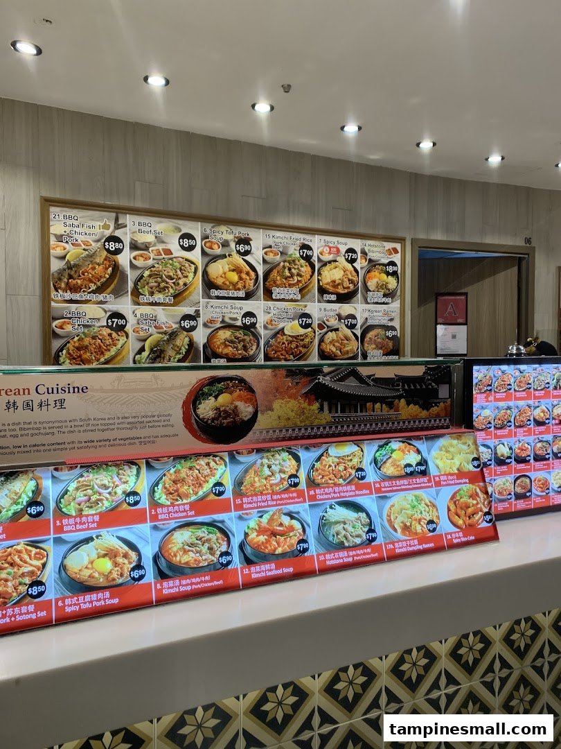 A vibrant display of menu boards showcasing various Korean dishes with images and prices at a food stall.