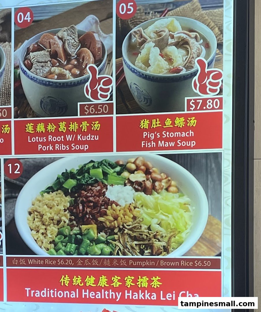 A digital menu board displaying traditional Asian soups and Hakka Lei Cha with various rice options.