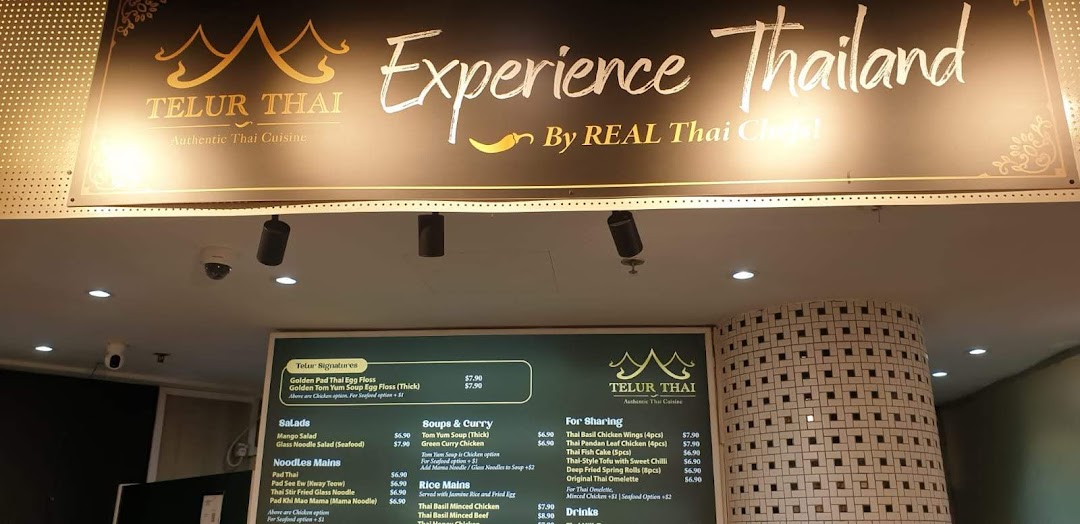 A menu board for Telur Thai, showcasing a variety of authentic Thai dishes and prices.