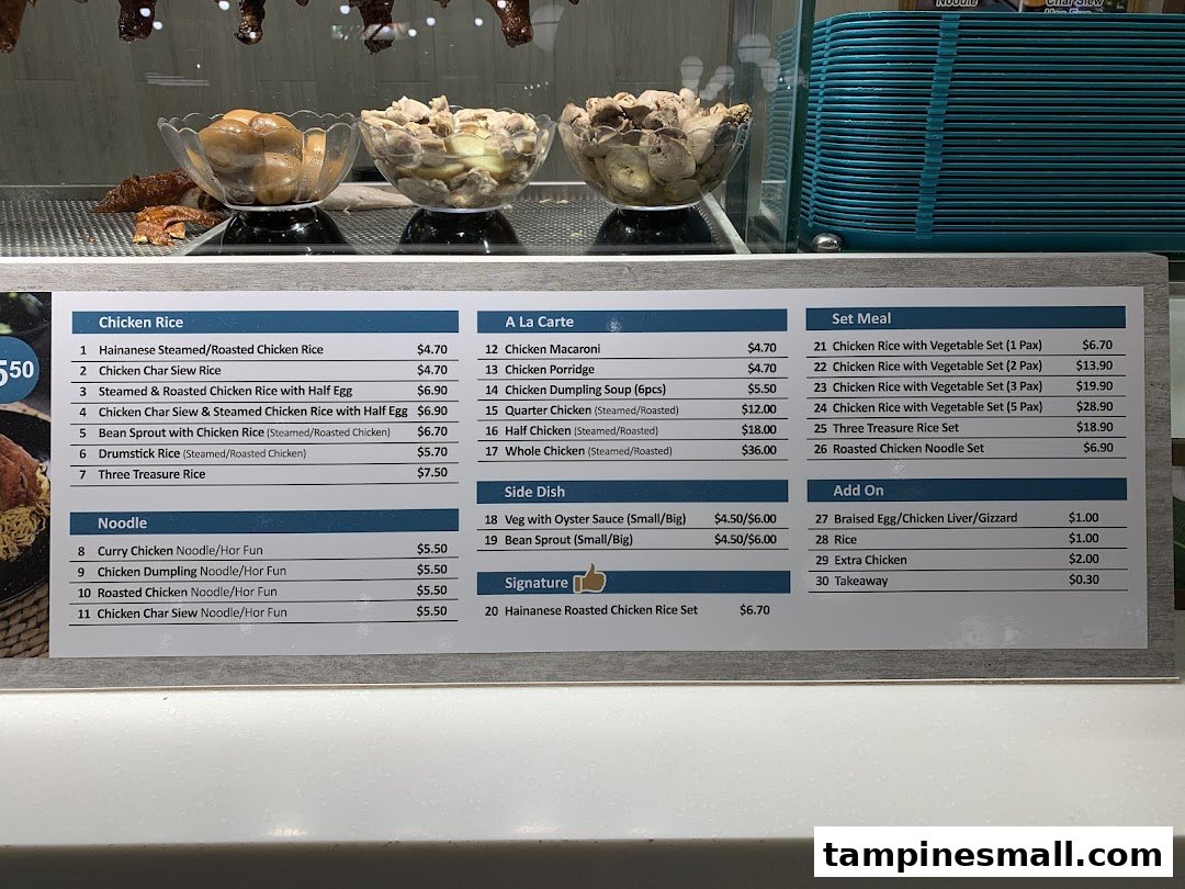 A detailed menu board displaying various chicken rice, noodle, and set meal options with prices.