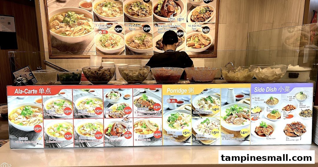 A vibrant menu board at Kopitiam showcasing a variety of traditional Singaporean dishes and side orders.