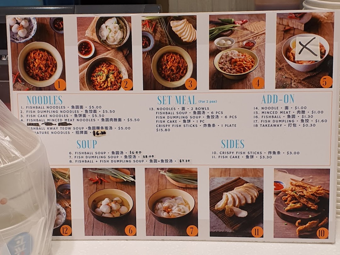 A detailed menu board for Kopitiam, showcasing various noodle dishes, soups, set meals, and sides with prices and images.