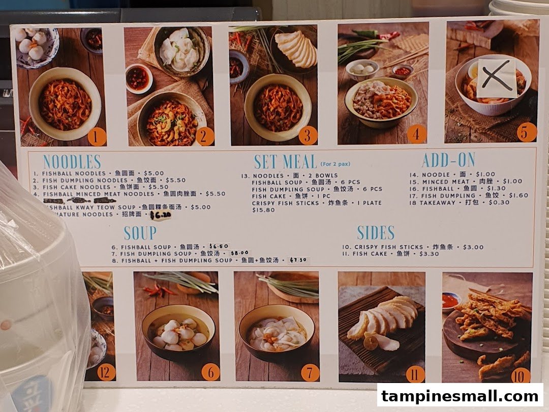 A detailed menu board for Kopitiam, showcasing various noodle dishes, soups, set meals, and sides with prices and images.