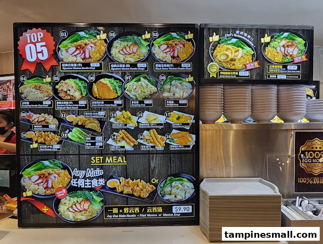 A large menu board showcasing various noodle dishes, sides, and a set meal offer at Kopitiam.