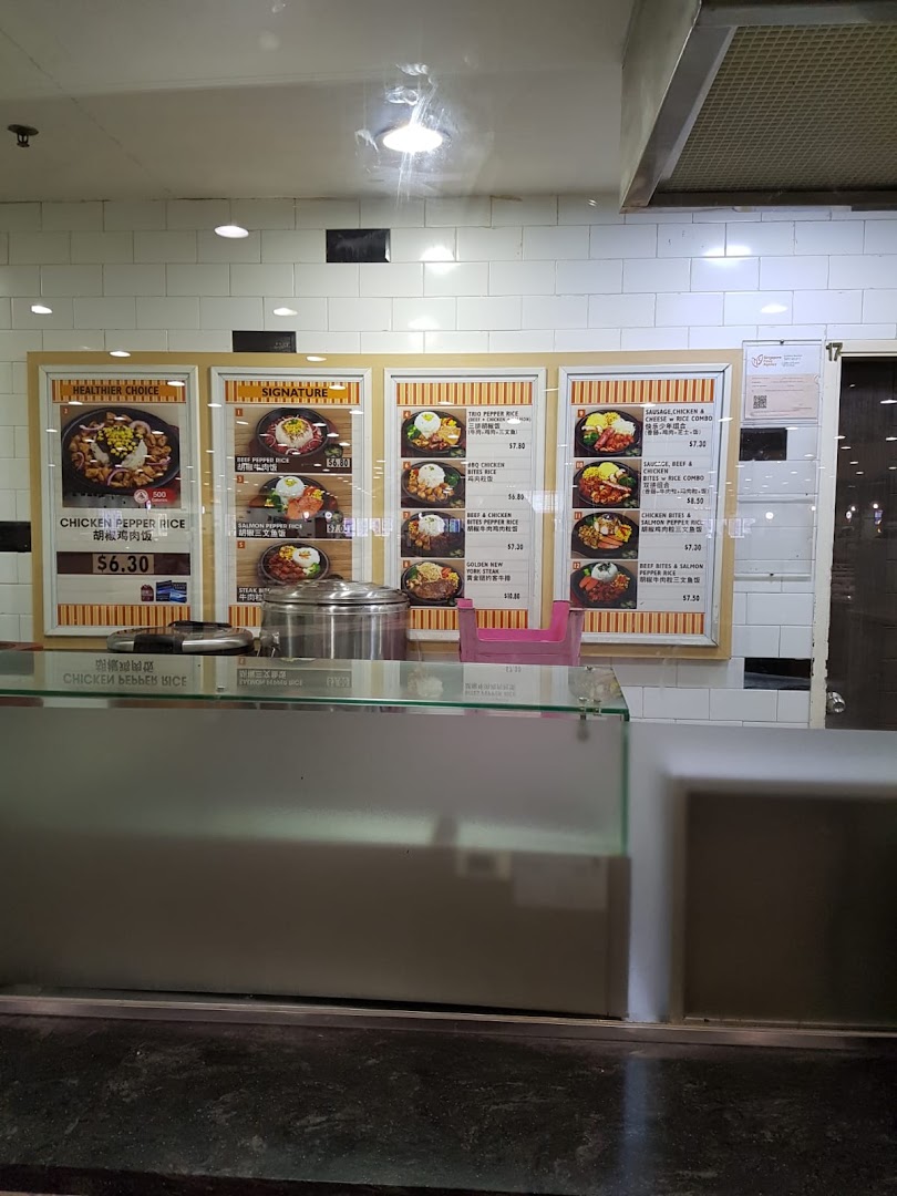 Menu boards at a food stall displaying various pepper rice dishes with prices and images.