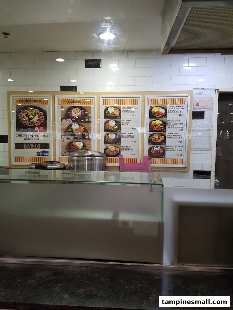 Menu boards at a food stall displaying various pepper rice dishes with prices and images.